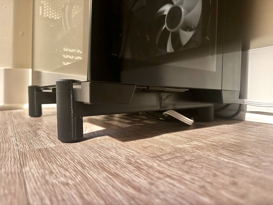 The printed PC floor mount in use under a desktop PC